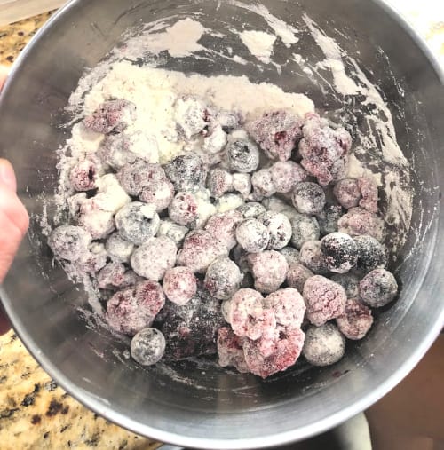 dust fruit with flour before adding to muffin batter