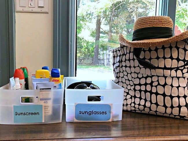  organizing sunscreen and sunglasses in a grab and go station