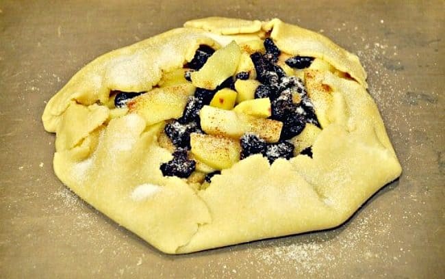 This apple galette recipe is made with dried cherries and it is the perfect dessert for fall! In case you are wondering, a galette is a "thin round cake or pastry". I would say it's a lot like a pie, but without the top crust or crumble topping. This is truly a family favorite!