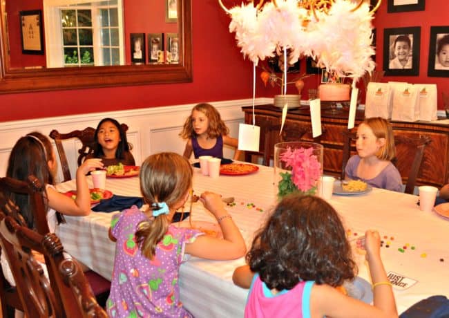 The half sleepover birthday party is the perfect idea for tweens! It has all the benefits of a sleepover party- girls wearing their jammies and snuggling up together to watch a movie and eat popcorn- without the actual sleeping over part! It's one of our favorite kids birthday parties to host!