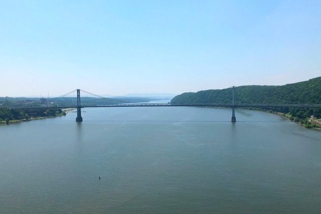 The Walkway Over the Hudson is a pedestrian walkway that once served as a railroad bridge. Originally constructed in 1889, it carried freight and passenger trains over the Hudson River, but the bridge ceased to carry rail traffic in 1974 when a fire destroyed the train tracks (but thankfully left the bridge unharmed). In 2009 the bridge was re-opened as a pedestrian walkway and bike path, as part of the Hudson Valley Rail Trail! It's a great place to take your kids!